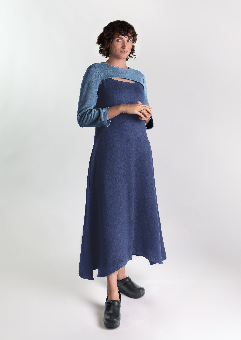 Woman is a cozy stylish dress that is chest port accessible for infusions. 
