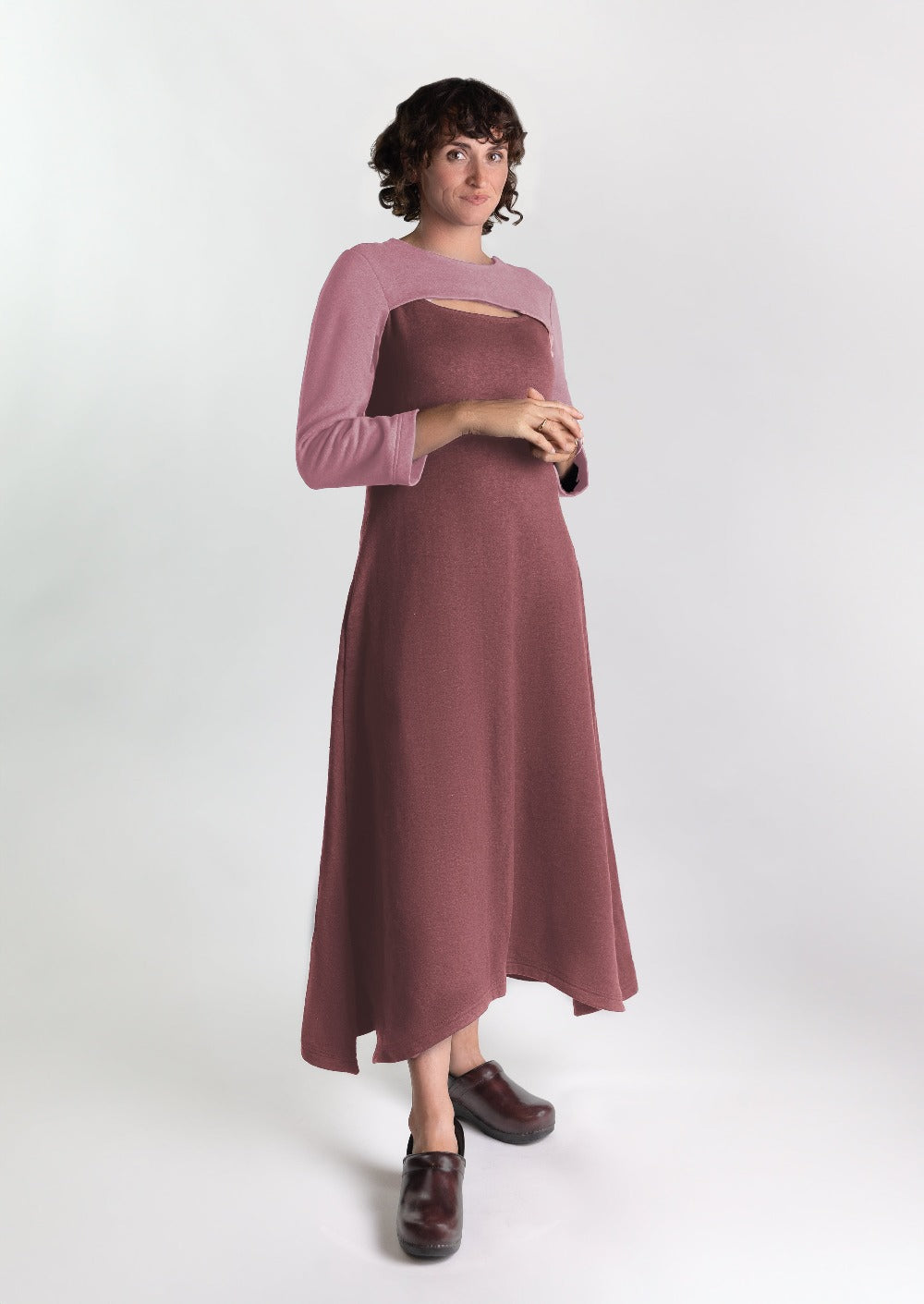 Woman is a cozy stylish dress that is chest port accessible for infusions. 