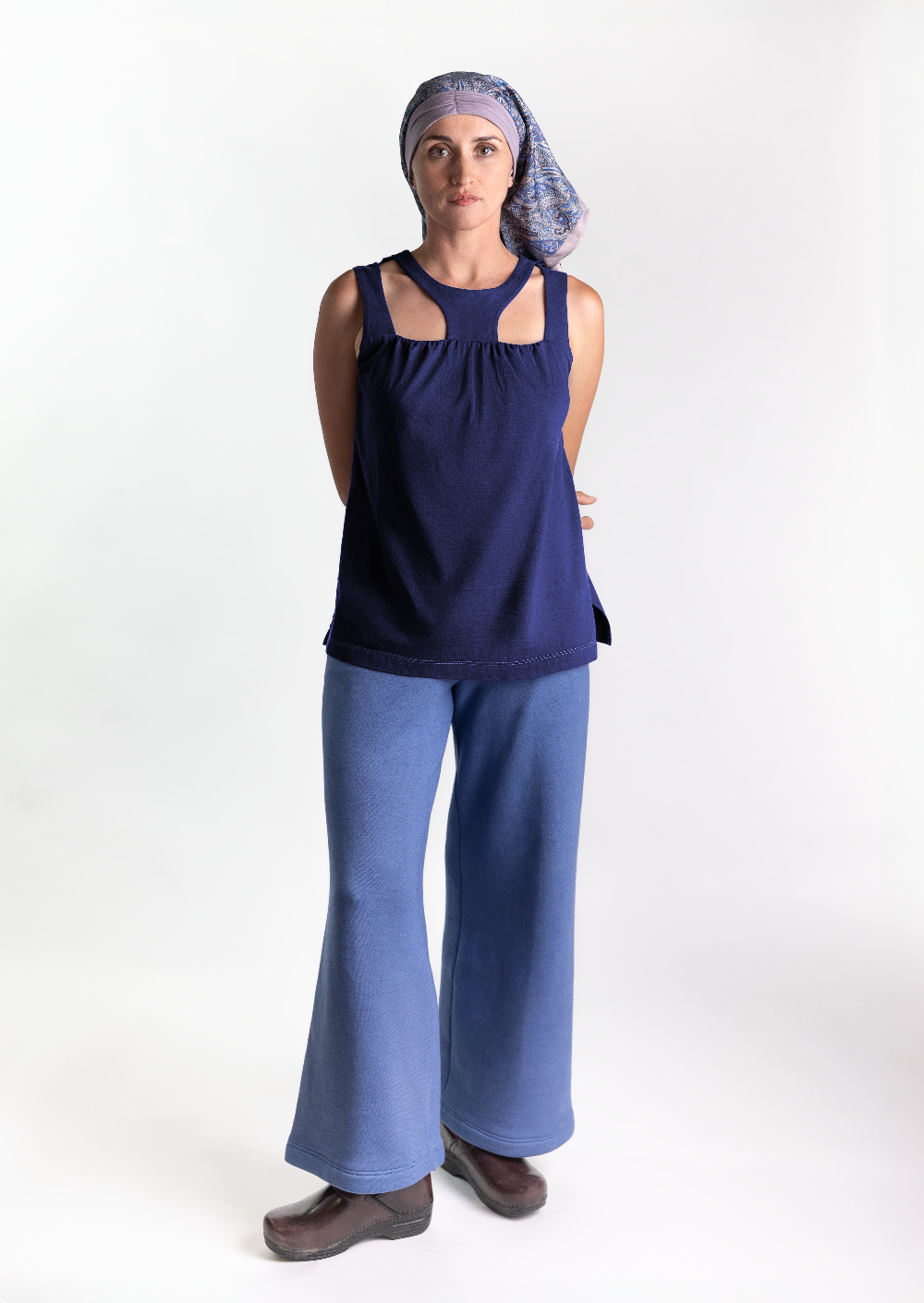 fashionable woman in a medically accessible adaptive wear tank top and headscarf 