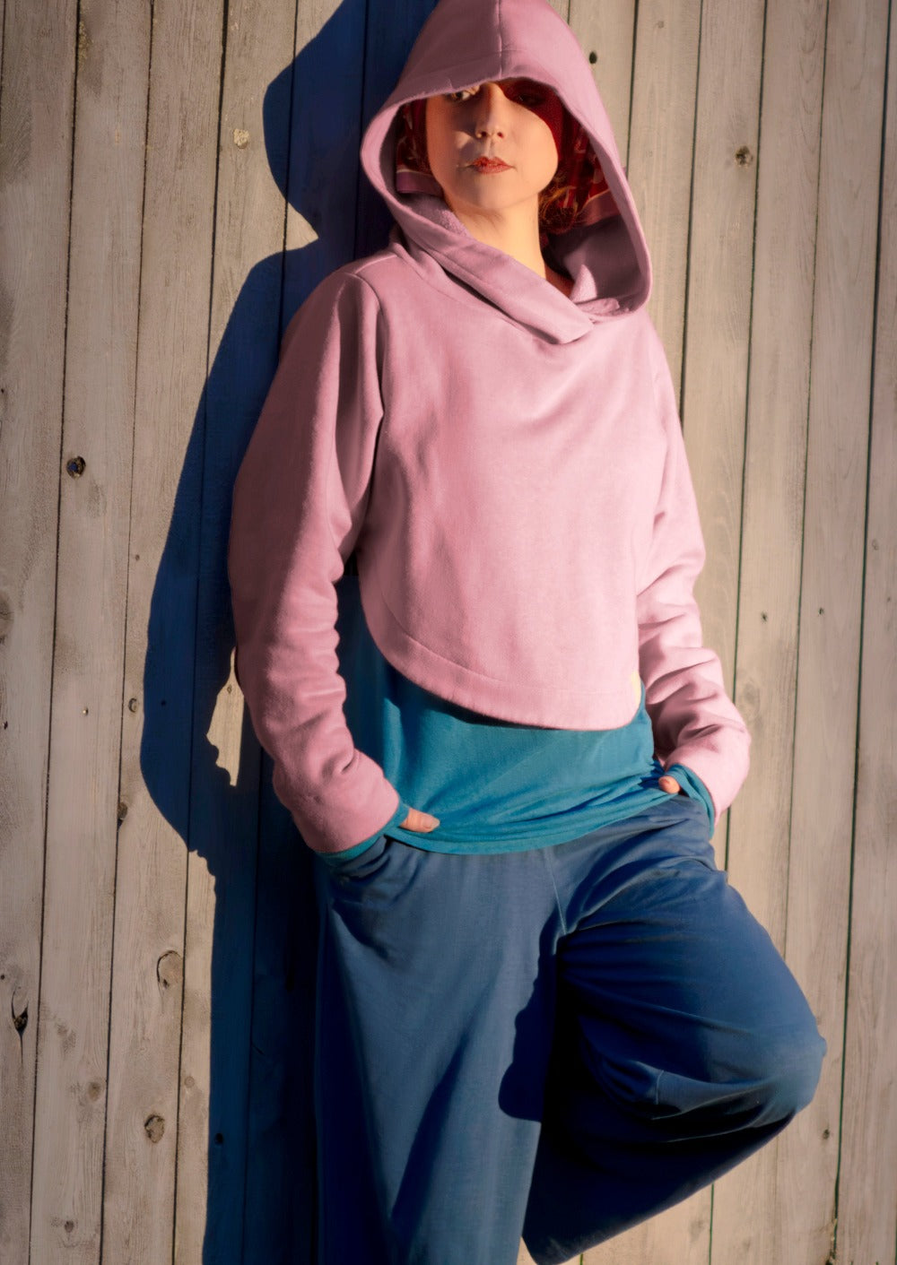 woman is pink hoodie and a pink headscarf for chemo head covering adaptive wear 