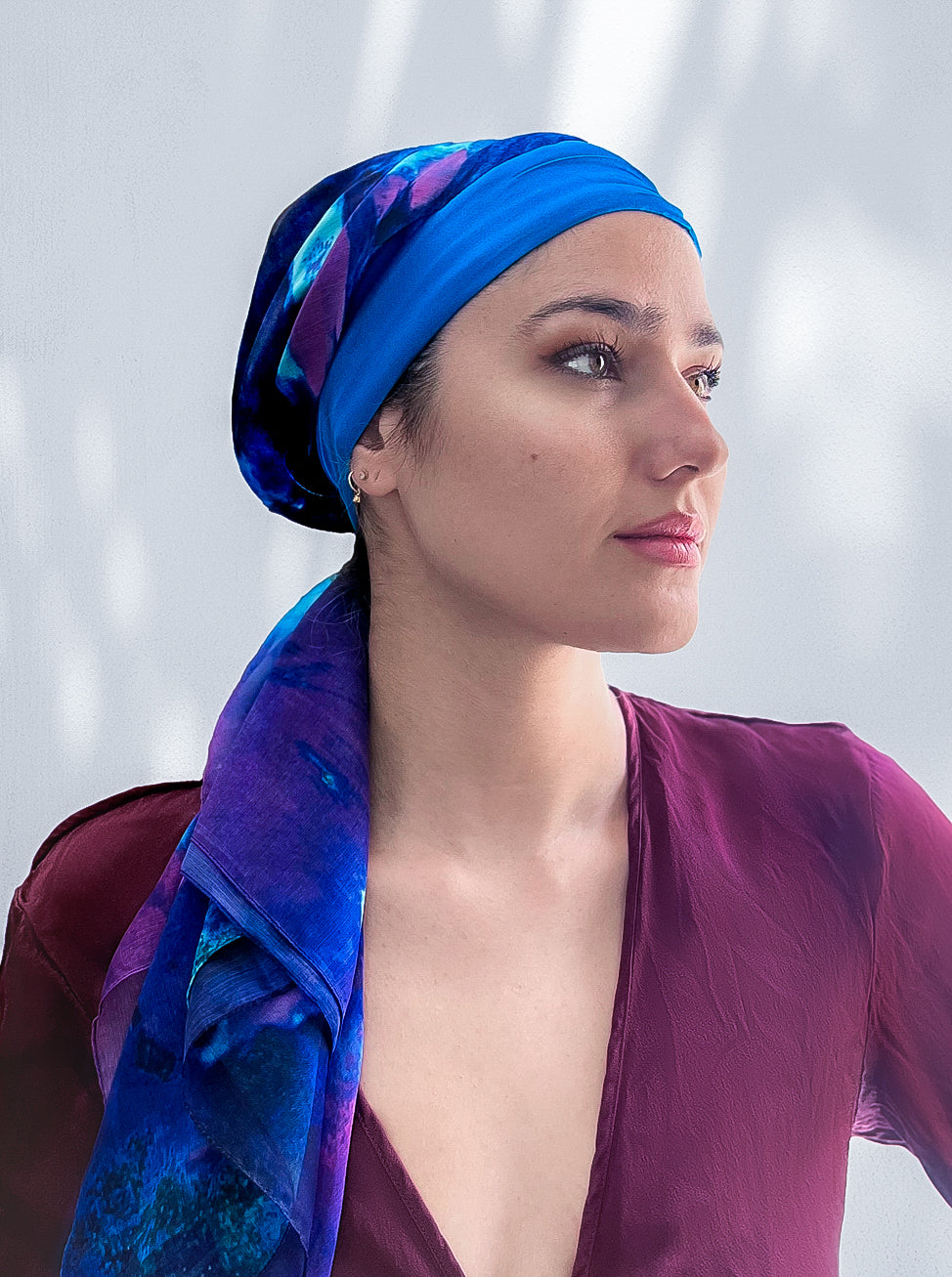 Woman in beautiful sapphire blue silk headscarf